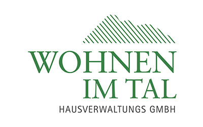 Das Logo zeigt den grünen Text „Wohnen im Tal Hausverwaltungs GmbH“ mit der stilisierten Umrisslinie eines Berges über den Worten.
